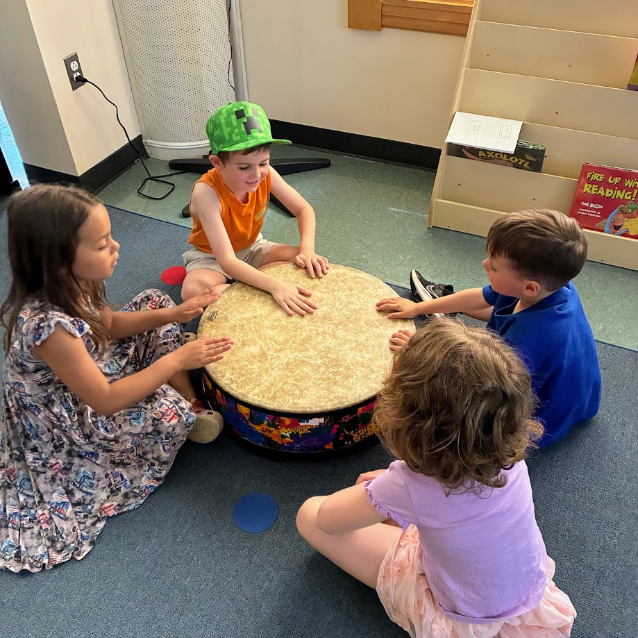 4 students drumming